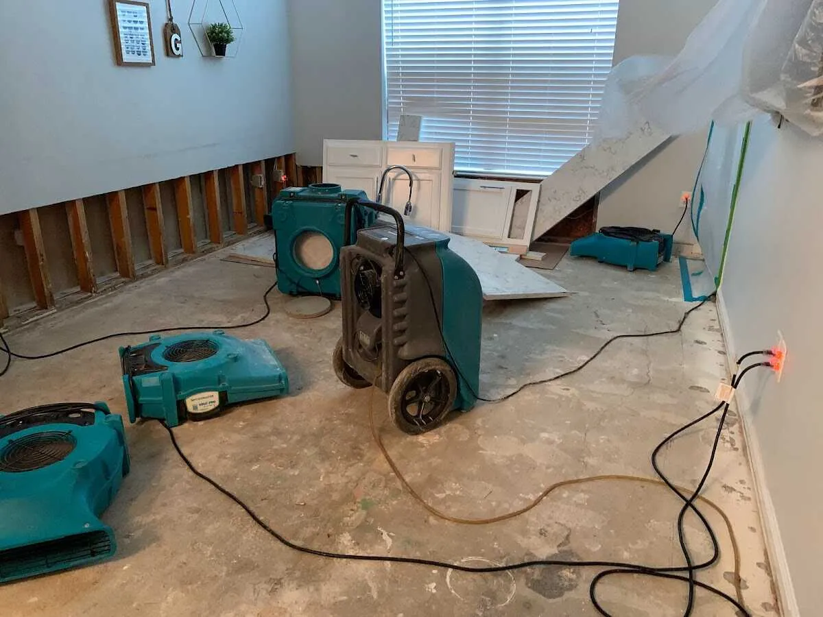 Dehumidifier in flood-cut room for Water Damage Restoration in Fort Lewis